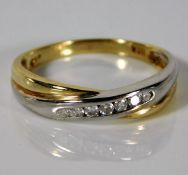 A 9ct two colour gold ring set with 0.15ct diamond