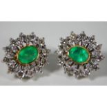 A 14ct gold pair of earrings set with approx. 2ct diamond & emeralds 12.8g