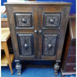 An antique style oak cupboard with relief decor do