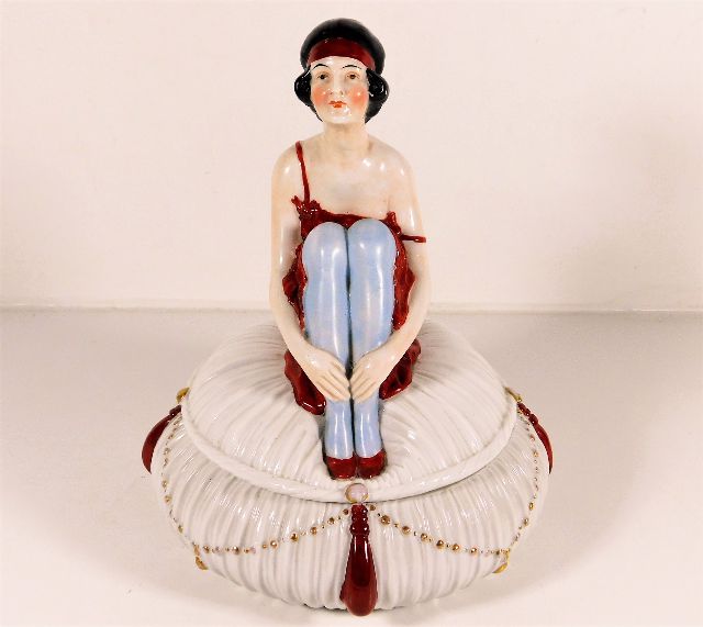 An art deco porcelain figurative pot & cover 9in H