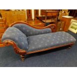 An upholstered Victorian chaise longue