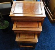 A Chinese rosewood nest of three tables