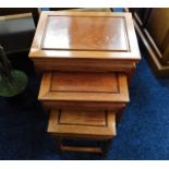 A Chinese rosewood nest of three tables