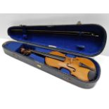 An antique violin in a G. Withers & Co. case