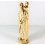 An Oriental carved ivory monk, some faults, signed
