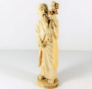 An Oriental carved ivory monk, some faults, signed