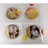 Four large commemorative gold plated proof medals