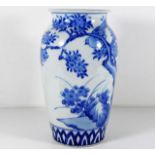 A Chinese porcelain vase with bird & foliage decor