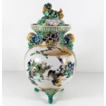 A decorative Chinese lidded vase with figurative d