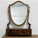 A serpentine fronted dressing table mirror