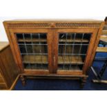 An antique oak bookcase with leaded glass 31.5in W