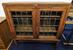 An antique oak bookcase with leaded glass 31.5in W