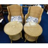 A pair of wicker chairs with matching tables