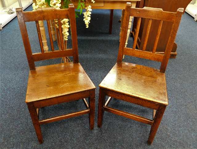 A pair of 19thC. oak hall chairs