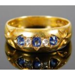 An 18ct gold ring set with diamond & sapphire 3.1g