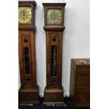 A brass faced longcase clock with rustic arts & cr
