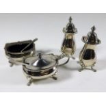 A four silver condiments including salt, mustard &