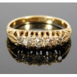 An antique 18ct gold ring set with five diamonds o