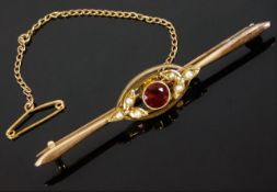 A 15ct gold bar brooch set with garnet & pearl 3.4