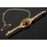 A 15ct gold bar brooch set with garnet & pearl 3.4