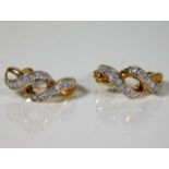 A pair of 9ct gold earrings set with diamonds 2.6g