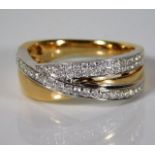 A 14ct two colour gold ring set with approx. 0.36c