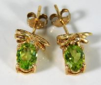 A pair of 9ct gold peridot & diamond earrings 2.3g