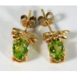 A pair of 9ct gold peridot & diamond earrings 2.3g