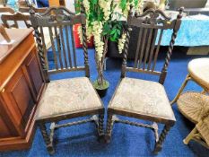 A pair of antique oak chairs with barley twist sup