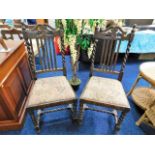 A pair of antique oak chairs with barley twist sup