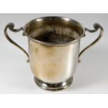 A silver two handled loving cup with base rim insc
