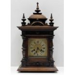 A decorative late Victorian walnut mantle clock 22