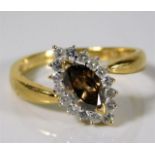 An 18ct gold ring set with marquise cut cinnamon c