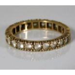 A 9ct gold eternity ring set with paste stones 2.4