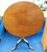 A mahogany tilt top pedestal table 30in dia