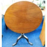 A mahogany tilt top pedestal table 30in dia