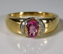 A 9ct gold ring set with pink sapphire & diamonds