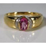 A 9ct gold ring set with pink sapphire & diamonds