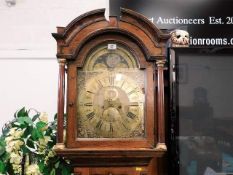 An oak cased brass faced moon dial clock by Samuel Davies, inscribed to top of dial "Time Of All Thi