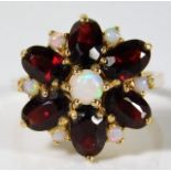 A 14ct gold ring set with garnet & opal 5.1g size M