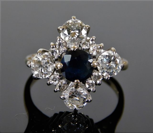 An 18ct white gold ring set with sapphire & approx