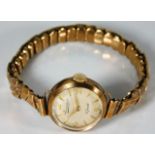 A 9ct gold cased watch with gold strap 19.9g inclu
