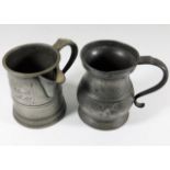 A pair of antique pewter tankards