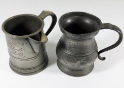 A pair of antique pewter tankards