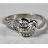An 18ct white gold ring set with diamonds, centre