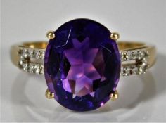 A 9ct gold ring set with diamond & amethyst 2.6g s