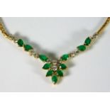 An 18ct gold necklace set with emerald & approx. 0