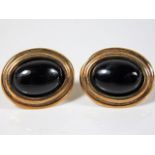 A pair of 9ct gold earrings set with onyx 3.1g