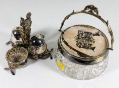 A cut glass butter dish with cow finial twinned with silver plated salt & mustard set with squirrel