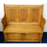 An oak monks bench with linenfold design to back 3